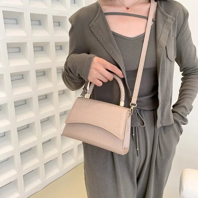 The Top Handle Sling Bag