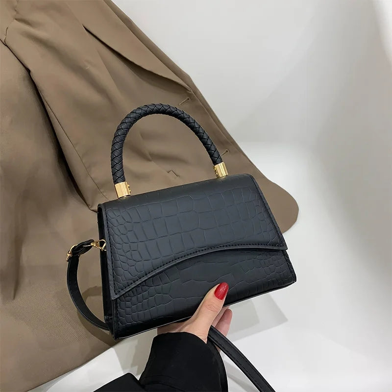 The Top Handle Sling Bag