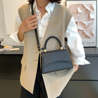 The Top Handle Sling Bag